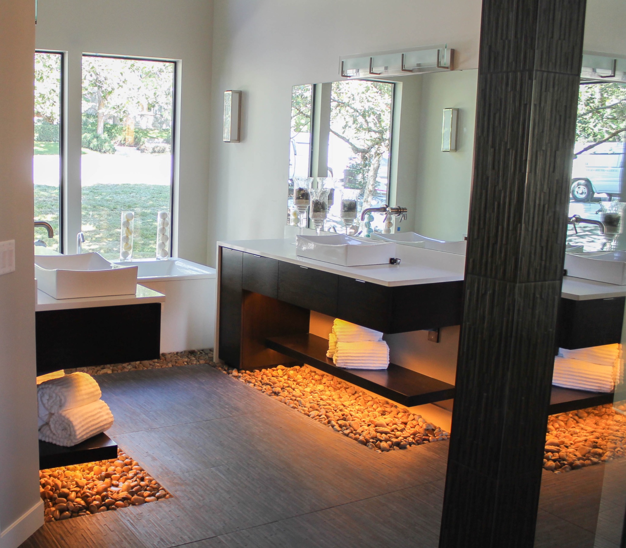 Modern spa bath with freestanding tub and illuminated floor